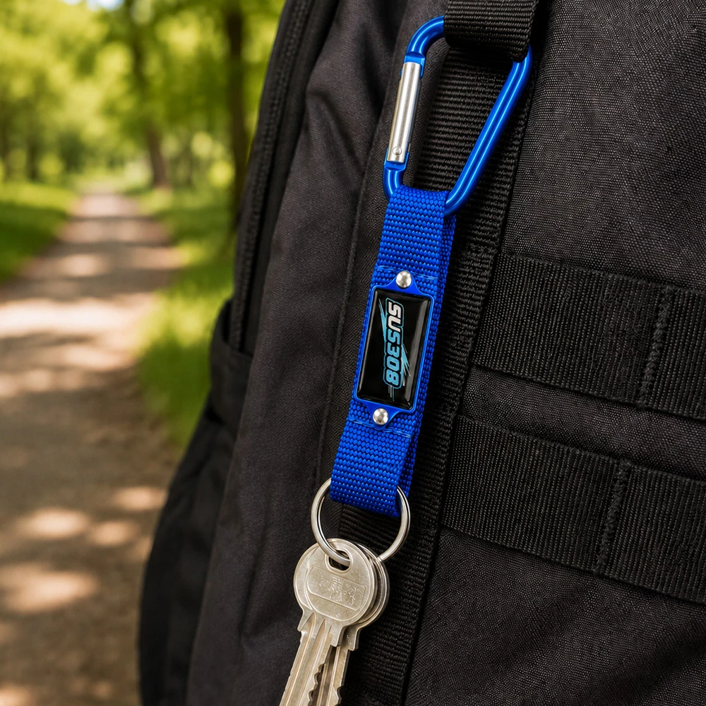 Custom aluminium carabiner keychain clipped to a backpack strap outdoors